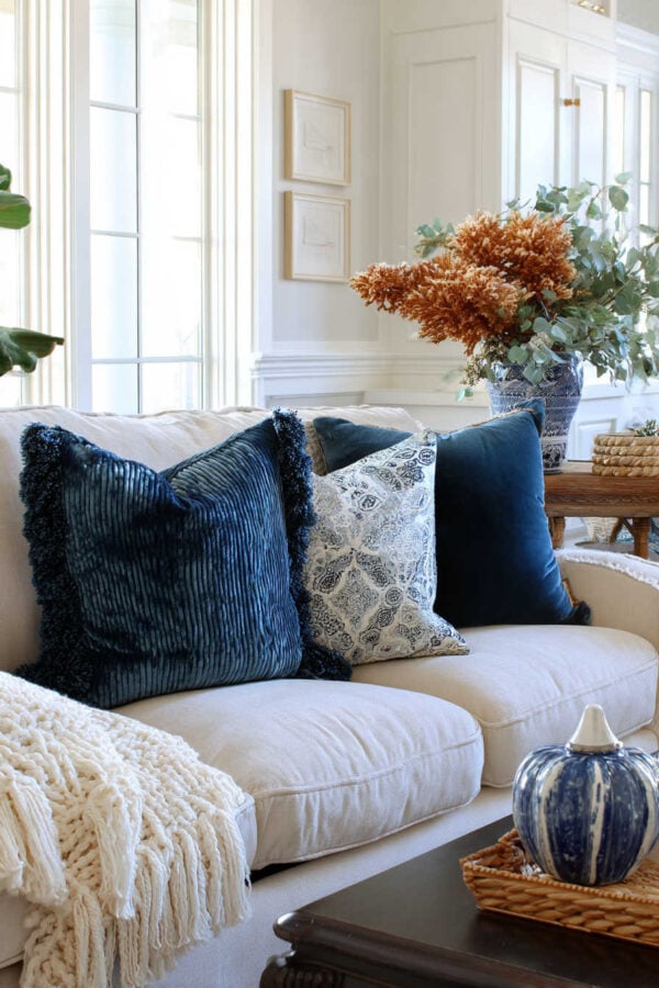 Soft blue and ivory tones feel elegant yet cozy for autumn - fall home decor - jane at home