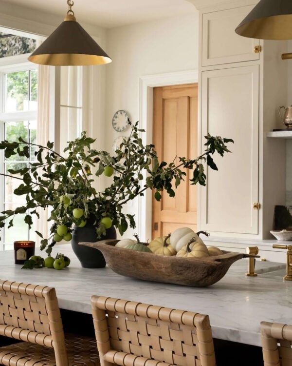 Beautiful fall kitchen decor with pumpkins and greenery