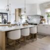 Love this beautiful kitchen design with woven counter stools, cone pendant lights, open shelving and natural and organic elements - intimate living interiors - Mediterranean style kitchen