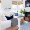 Our small living room with a slipcovered sectional and round wood coffee table - jane at home - living room decor - living room furniture - living room table - coastal decor - coastal living room - coastal grandmother - coastal grandma - hearth room