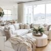 Beautiful modern living room with large white sectional, neutral decor, and leather ottoman coffee table - living room furniture - living room table - living room design - open concept living room ideas