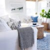 Our small living room with a slipcovered sectional and round wood coffee table - jane at home - living room decor - living room furniture - living room table - coastal decor - coastal living room - coastal grandmother - coastal grandma