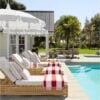 Beautiful outdoor patio area with chaise lounge chairs and umbrellas - Serena & Lily