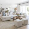 Love this light and airy modern living room design with a large sectional, round wood center coffee table, and neutral furniture and decor - living room ideas - living room furniture - living room table ideas - living room decor - modern coastal living room