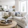 Beautiful beach house style living room with sectional and round wood coffee table - pure salt interiors