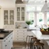 Love this beautiful kitchen with white cabinets and two kitchen islands - nancy meyers kitchen - arch digest