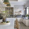 Love this beautiful kitchen design with woven counter stools, cone pendant lights, open shelving and gorgeous kitchen island styling and decor - intimate living interiors - Mediterranean style kitchen