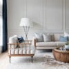 Love this beautiful modern living room design with neutral decor and furniture, a round wood coffee table, gray walls, and picture frame wall moulding - living room ideas - living room decor